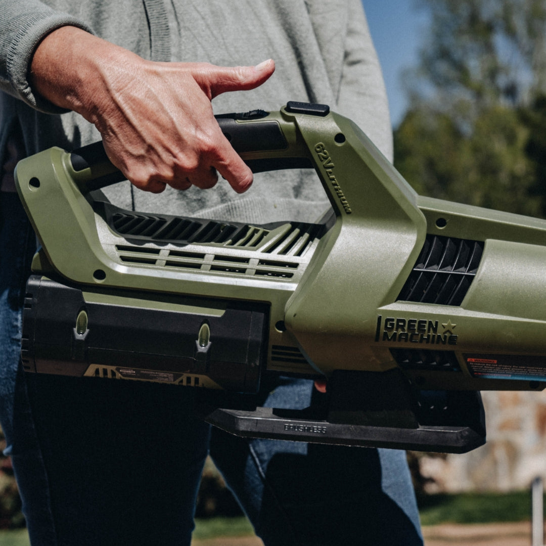 Close up of woman holding Green Machine blower.