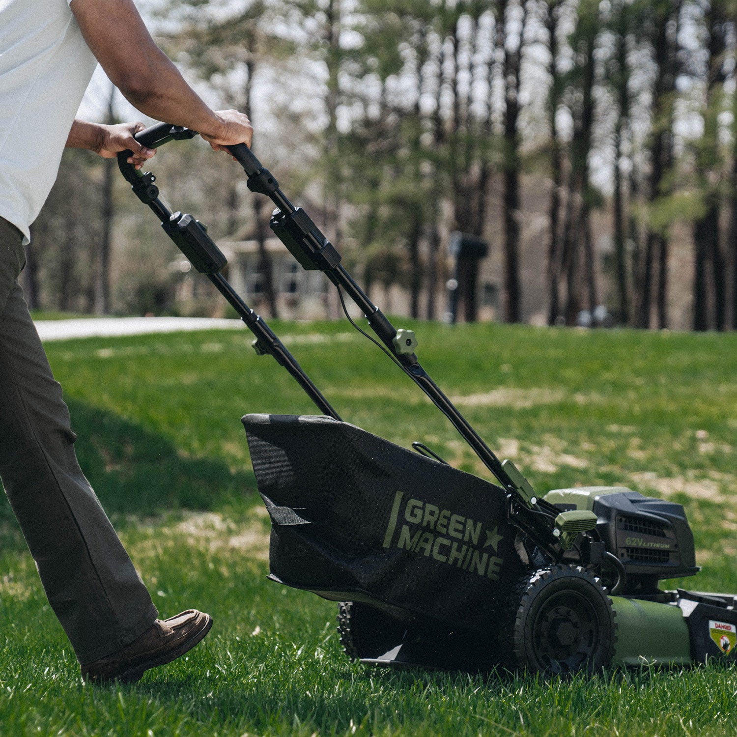 Self propelled outlet walk behind mower